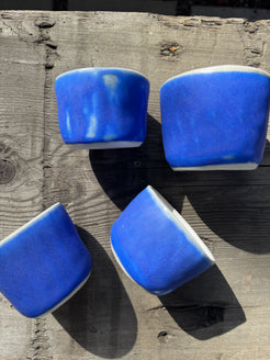 Hand made porcelain cups in cerulean blue