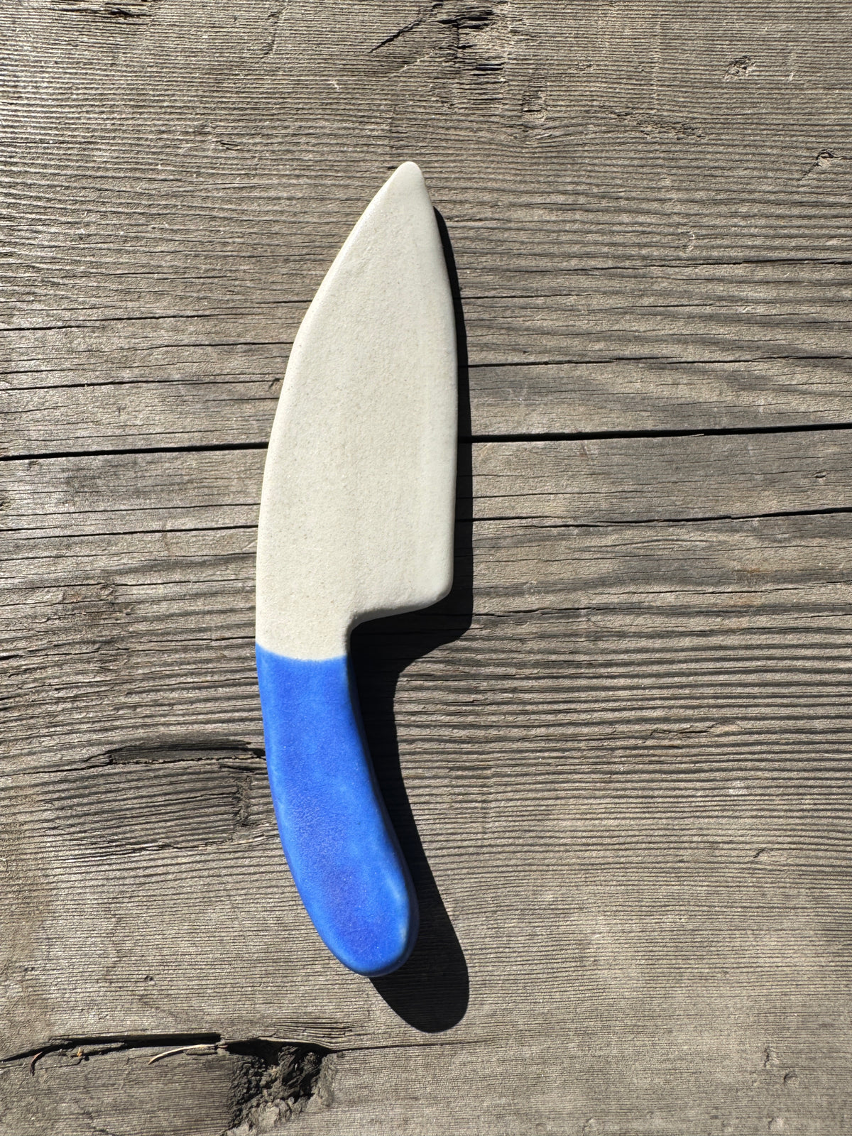 handmade porcelain cheese knife with blue handle