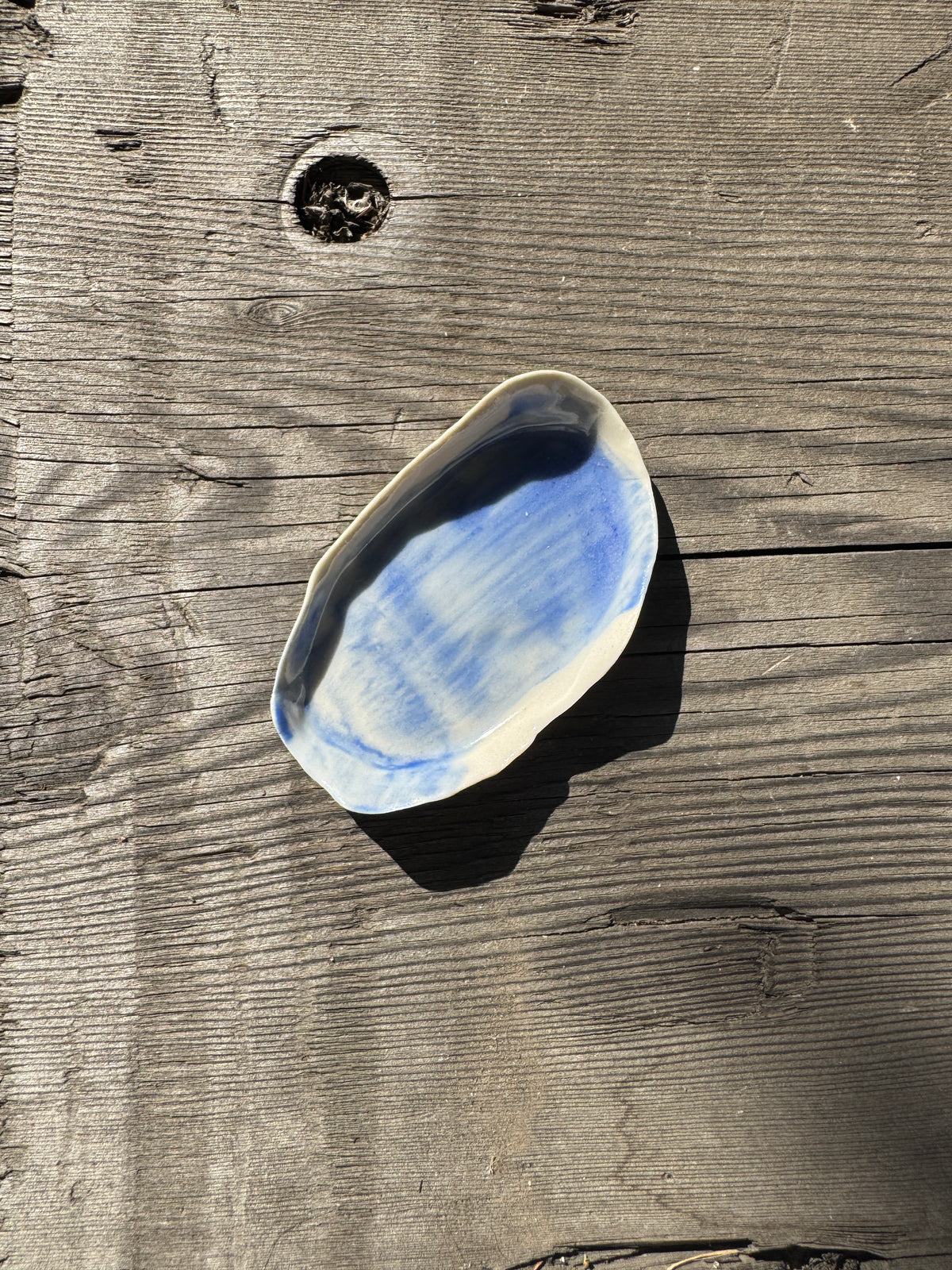 A hand formed blue painted dish