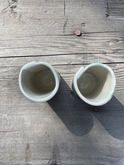pair of hand formed porcelain cups