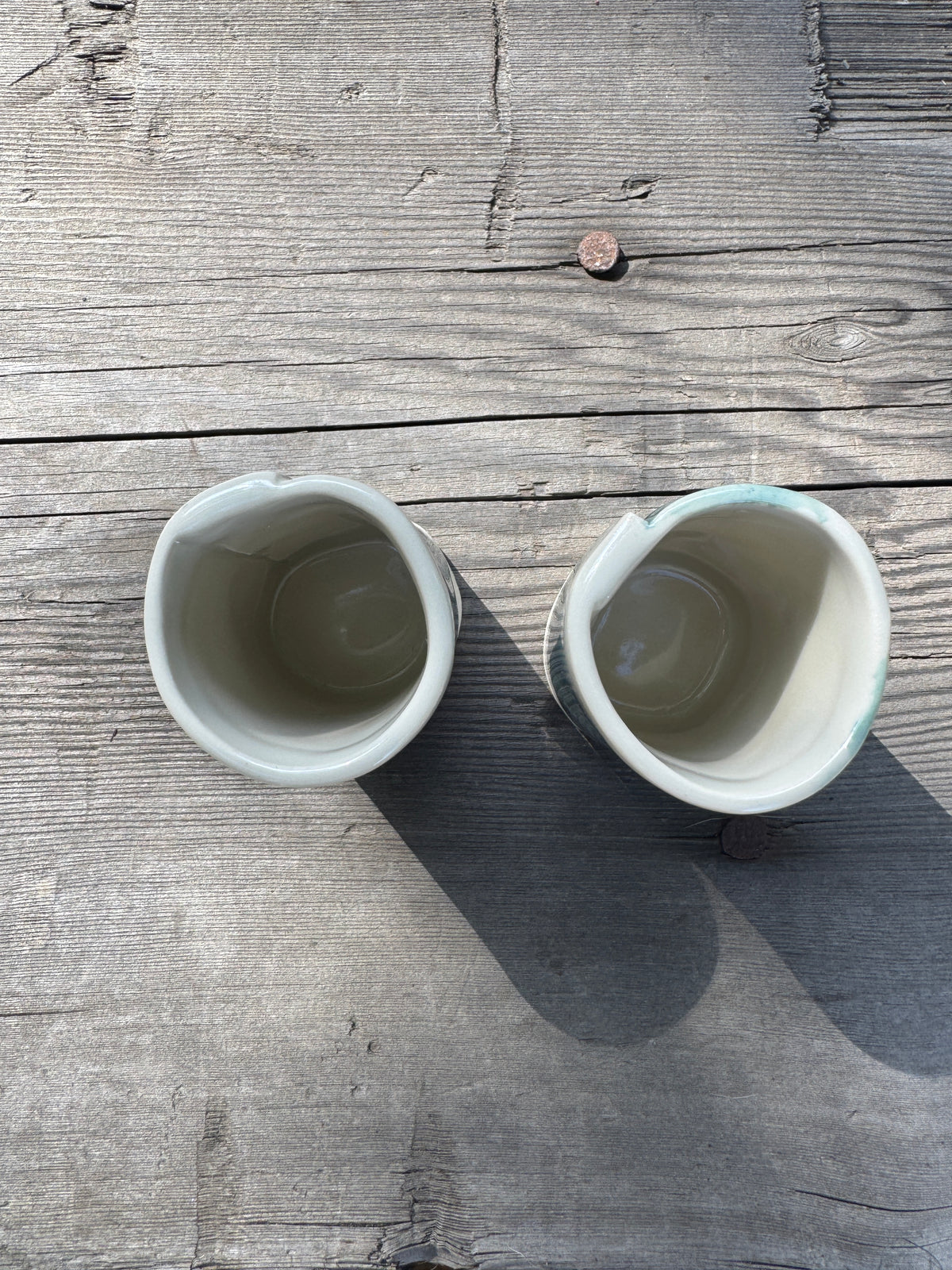 pair of hand formed porcelain cups