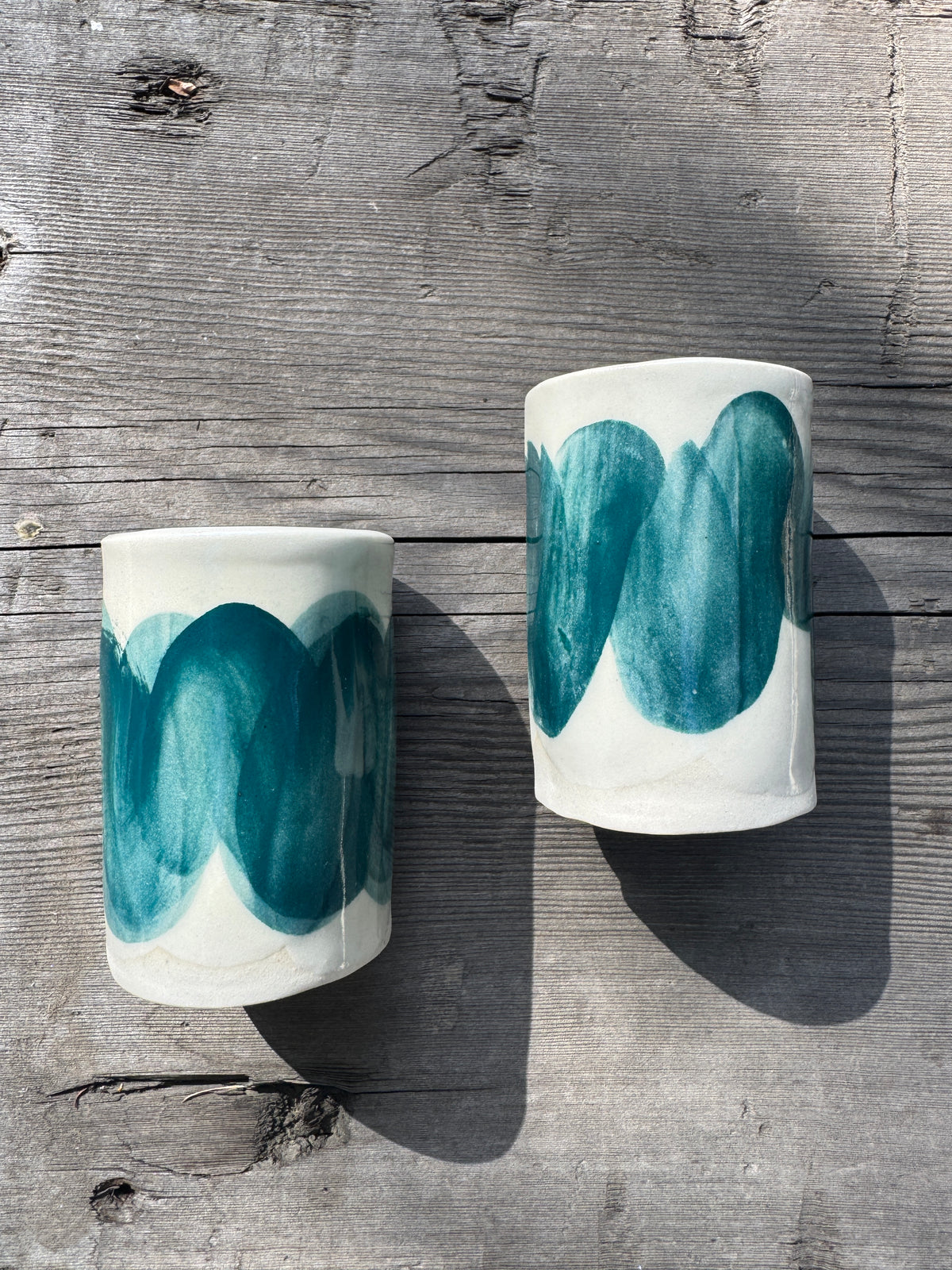 Pair of wave painted porcelain cups