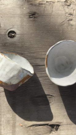 Pair of earthenware cups with white glaze